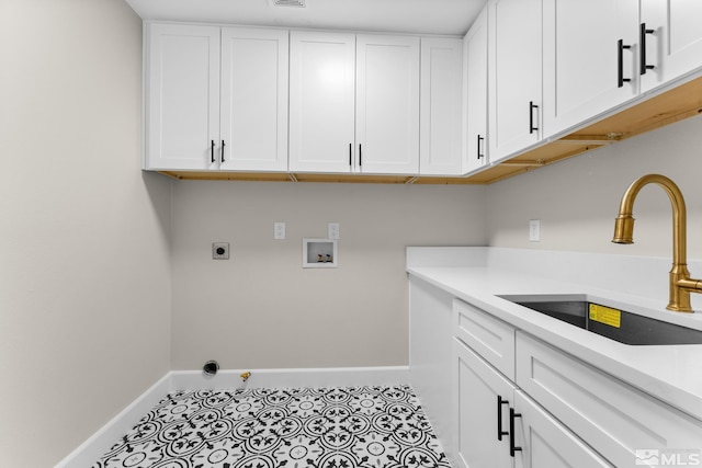 laundry area with sink, cabinets, light tile patterned floors, electric dryer hookup, and washer hookup