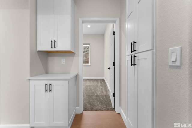 hallway with light wood-type flooring