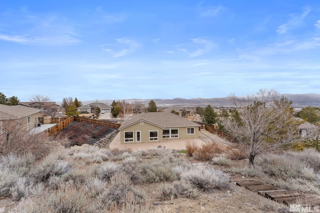 back of house with a mountain view