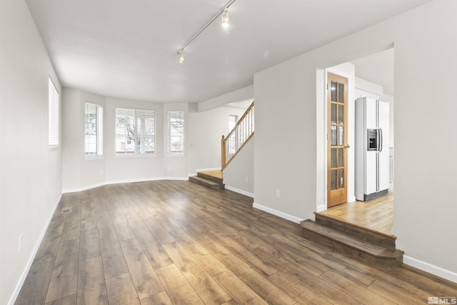 unfurnished living room featuring wood-type flooring