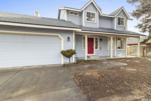 view of front facade with a garage and a porch