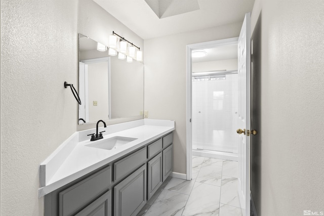 bathroom with vanity and a shower