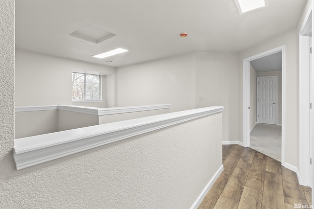 hallway featuring hardwood / wood-style flooring