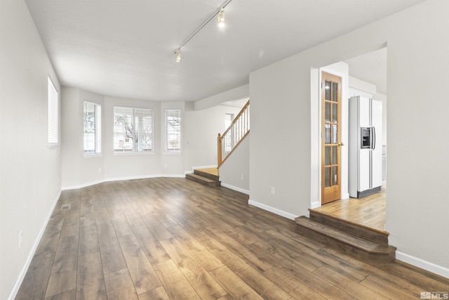 unfurnished living room with hardwood / wood-style floors