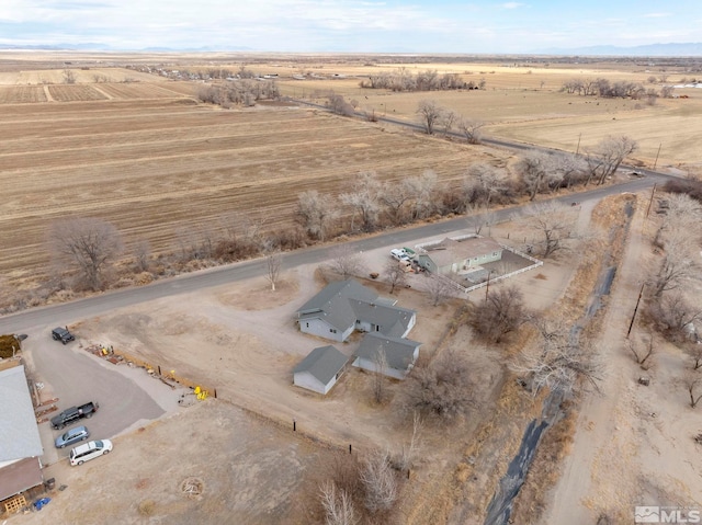 birds eye view of property featuring a rural view