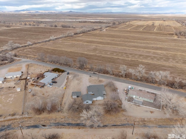 birds eye view of property featuring a mountain view and a rural view