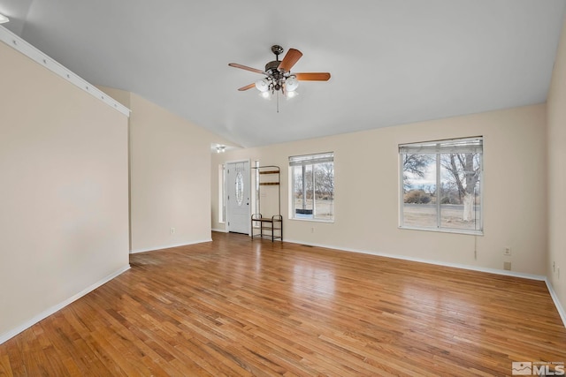 unfurnished room featuring vaulted ceiling, ceiling fan, and light hardwood / wood-style floors