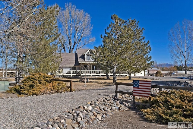 view of front of home featuring a mountain view