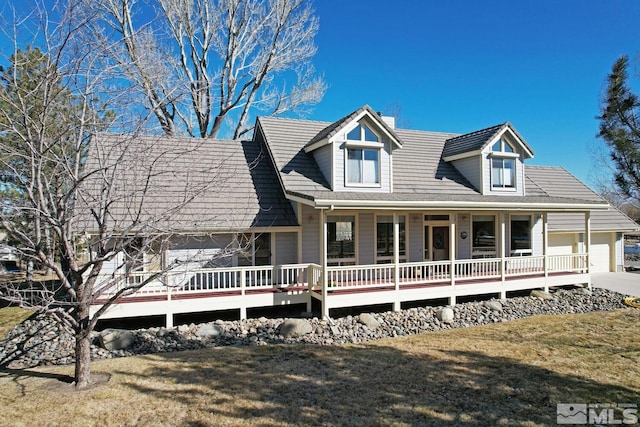 view of front of house with a porch and a front lawn