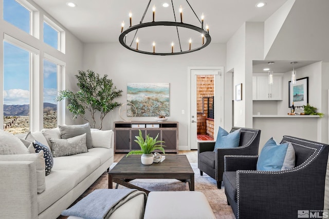 living room with a mountain view and a notable chandelier