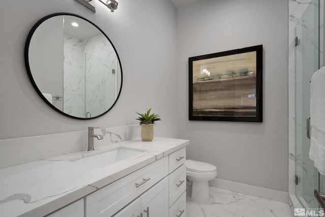 bathroom with vanity, toilet, and a shower with shower door