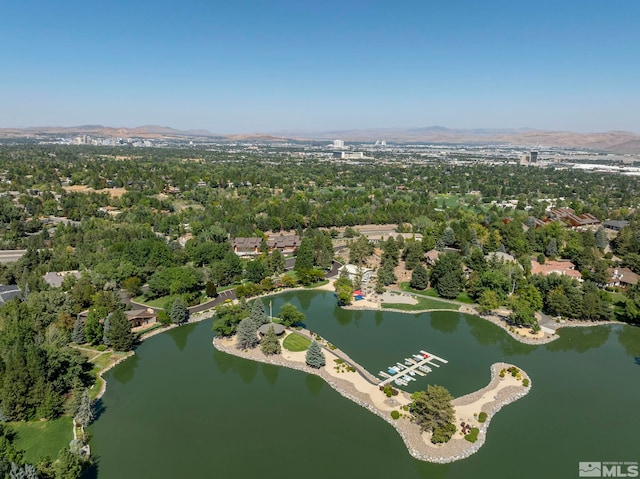 drone / aerial view with a water and mountain view