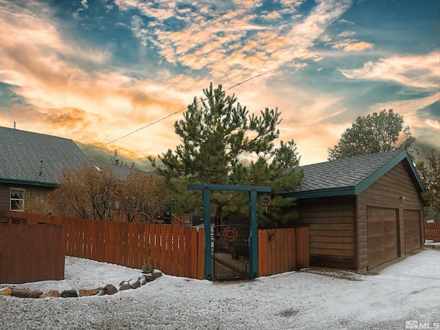 yard at dusk with a garage