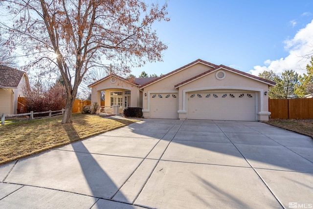 view of front of home featuring a garage and a front yard