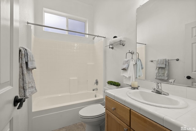 full bathroom with washtub / shower combination, vanity, and toilet