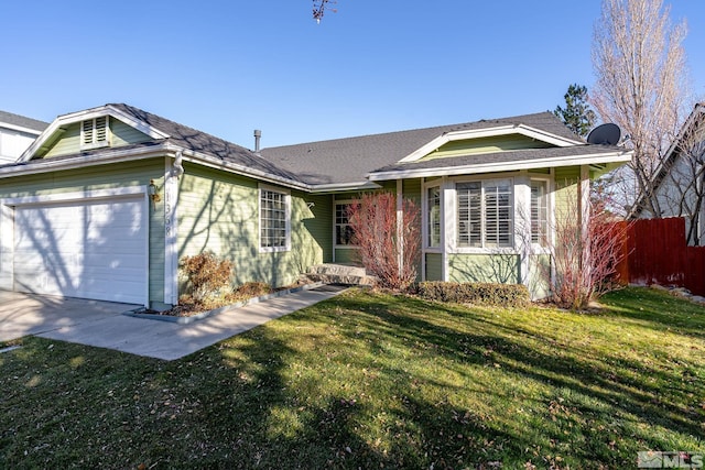 ranch-style house featuring a garage and a front yard