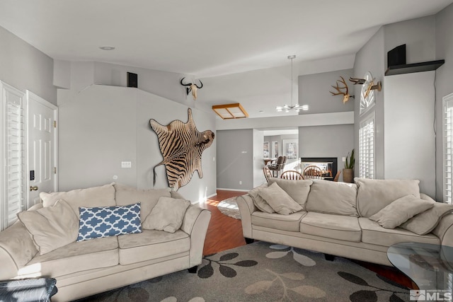 living room featuring hardwood / wood-style flooring and lofted ceiling