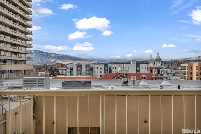 balcony featuring a mountain view