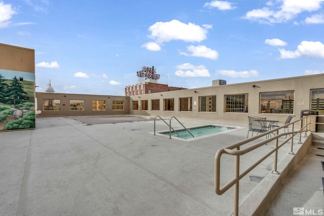 view of swimming pool featuring a patio area