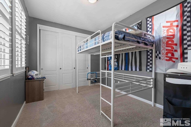 carpeted bedroom with a closet