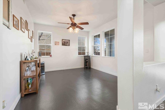 unfurnished room featuring ceiling fan