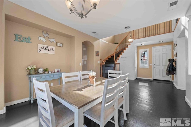 dining space featuring an inviting chandelier