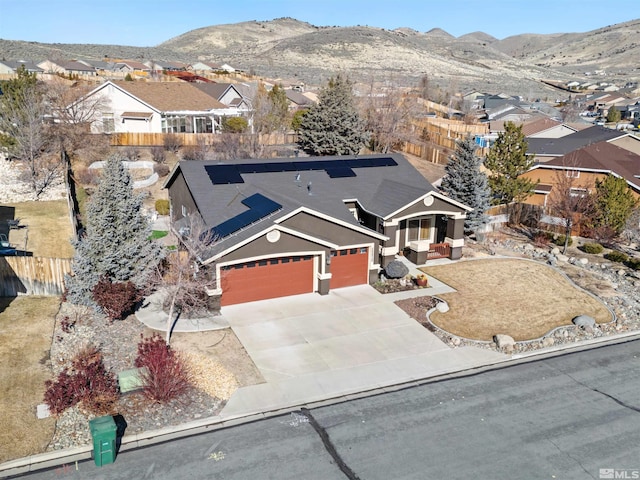 view of front of home featuring a mountain view and a garage