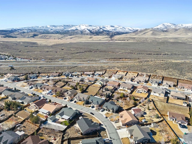 birds eye view of property with a mountain view