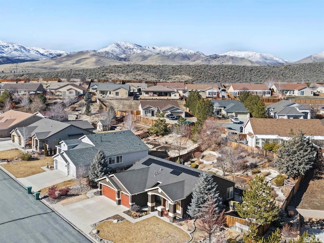 birds eye view of property with a mountain view