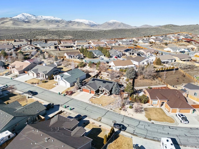 birds eye view of property featuring a mountain view