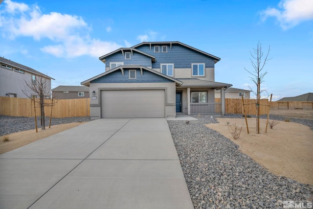 view of front of home with a garage and covered porch