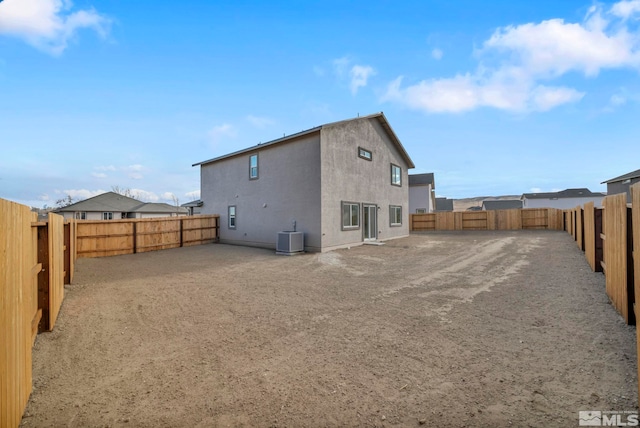 rear view of property featuring cooling unit