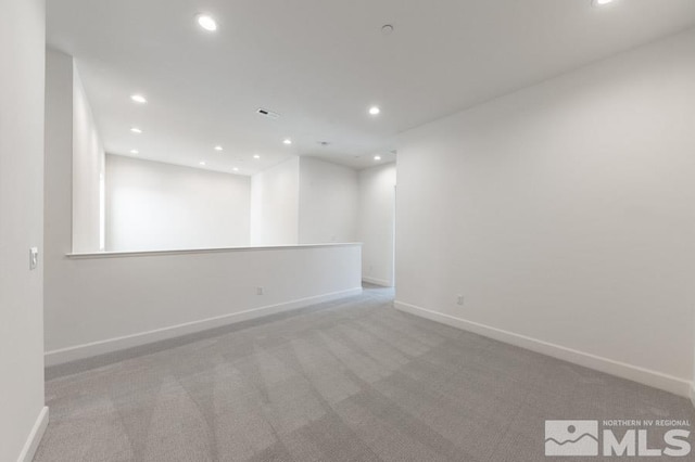 spare room with light colored carpet