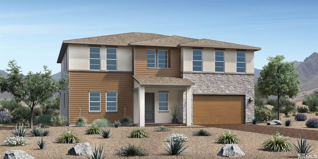 view of front of house featuring a garage and a mountain view