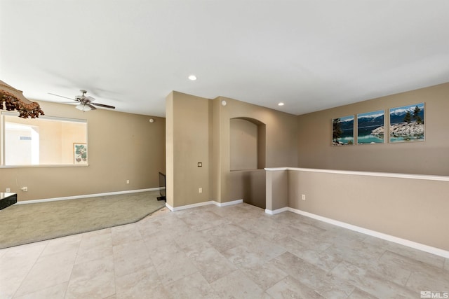 carpeted empty room with ceiling fan