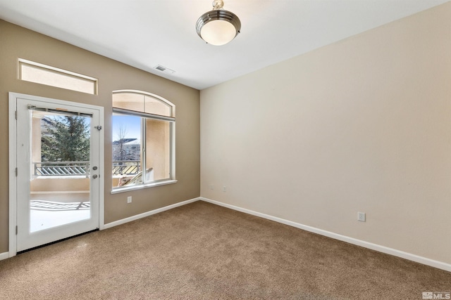 empty room with carpet flooring