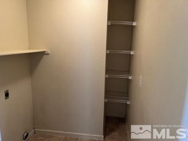 clothes washing area featuring hookup for an electric dryer