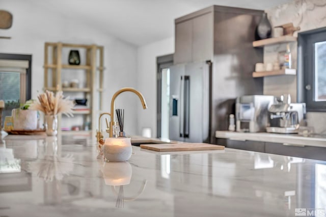 details with gray cabinets and high end fridge