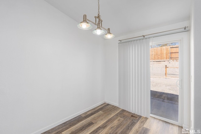 empty room with dark hardwood / wood-style floors