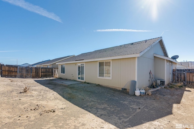 rear view of property with central air condition unit