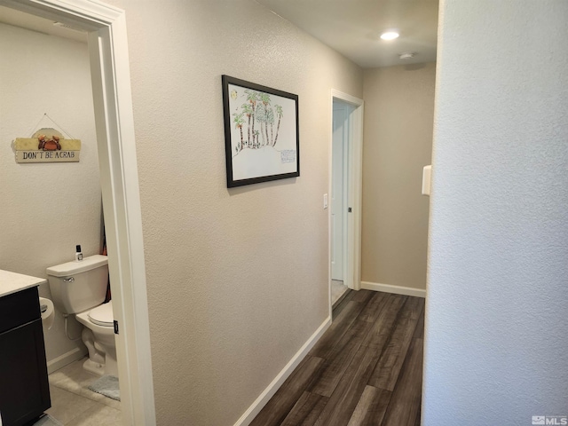 hall with dark hardwood / wood-style flooring