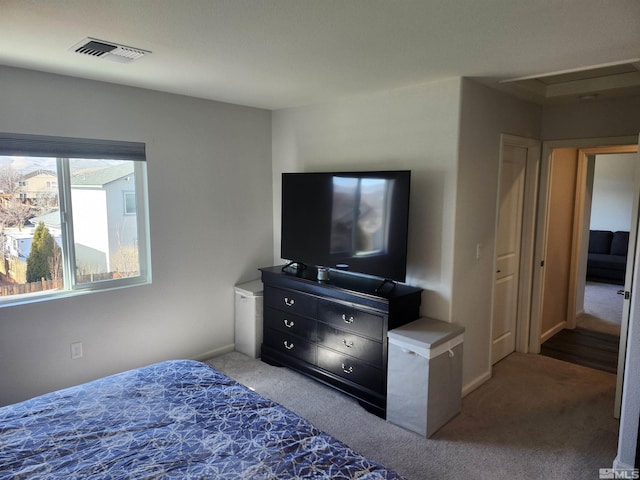 bedroom with light colored carpet