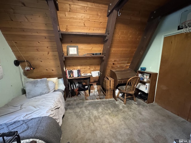 bedroom with carpet flooring and wooden walls