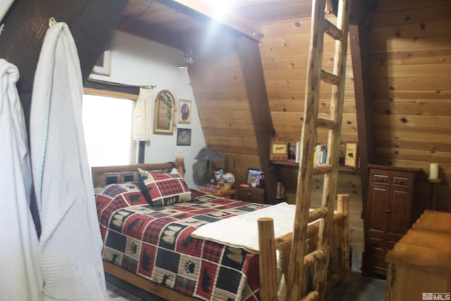 bedroom with wood walls