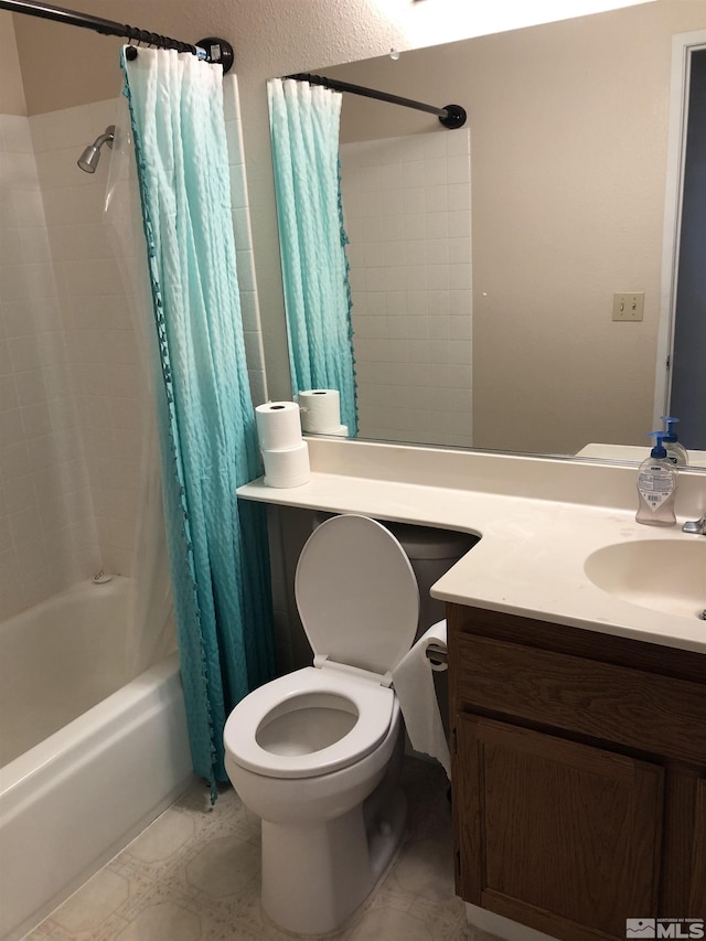 full bathroom featuring vanity, shower / bath combination with curtain, and toilet