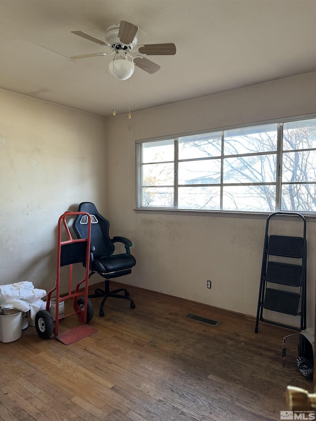 home office with ceiling fan and hardwood / wood-style floors