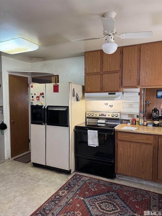 kitchen with ceiling fan, black electric range, and white fridge with ice dispenser