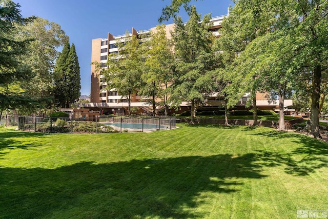 view of yard featuring a community pool