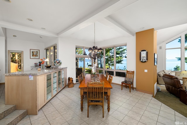 tiled dining room featuring beam ceiling and a notable chandelier