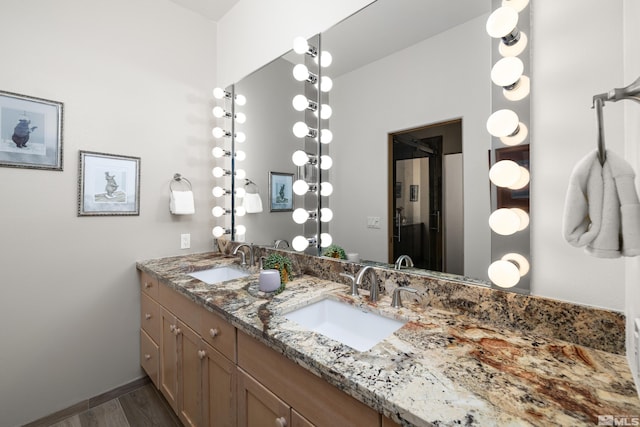 bathroom featuring vanity and hardwood / wood-style floors